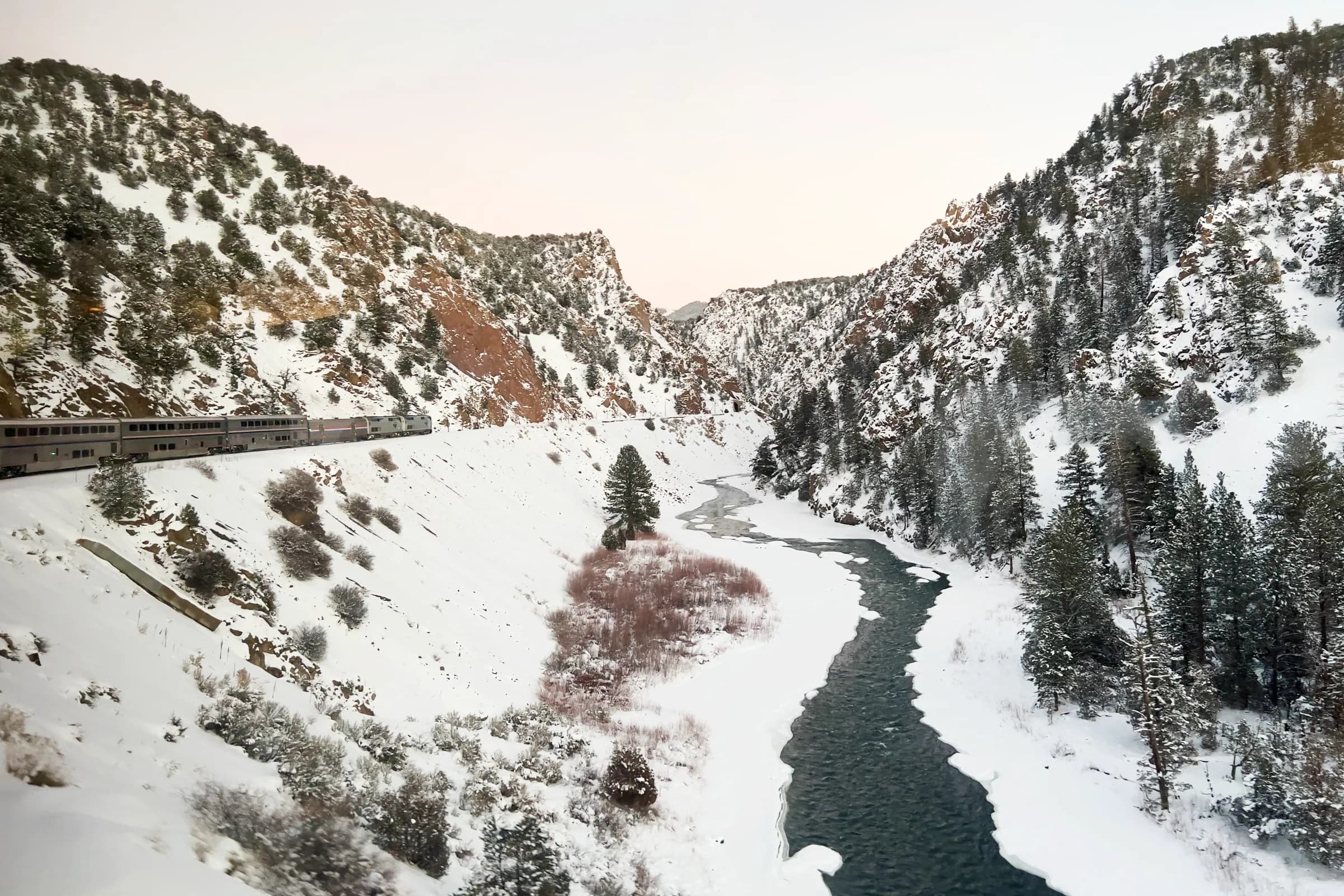 The California Zephyr heading east along the Colorado River in the Gore Valley Canyon